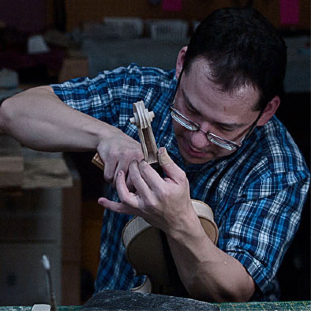 String instrument repairer in residence at Prairie Cello Institute 2019